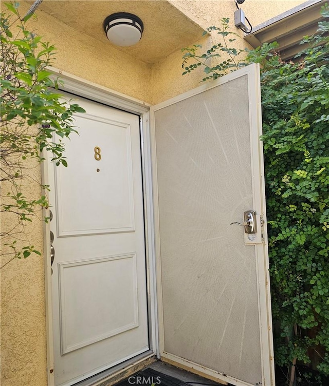 9315 Woodman Ave Unit 8, Arleta, CA 91331 - view of exterior entry featuring stucco siding