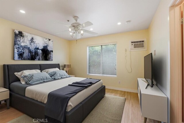 9315 Woodman Ave Unit 8, Arleta, CA 91331 - bedroom featuring light wood-type flooring, a wall unit AC, baseboards, recessed lighting, and ceiling fan