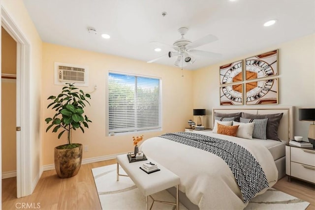 9315 Woodman Ave Unit 8, Arleta, CA 91331 - bedroom featuring a wall mounted air conditioner, wood finished floors, baseboards, recessed lighting, and ceiling fan