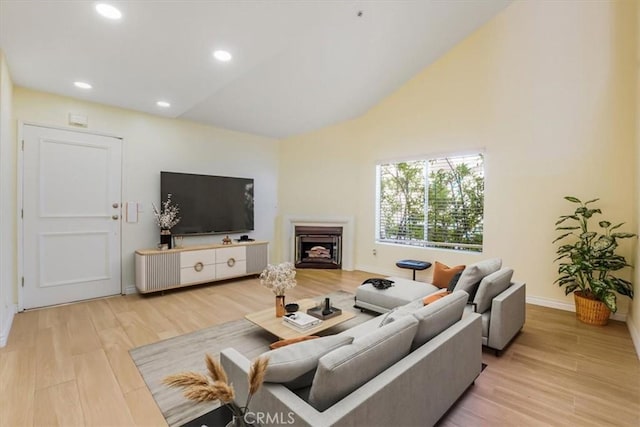 9315 Woodman Ave Unit 8, Arleta, CA 91331 - living room with wood finished floors, a fireplace, baseboards, and recessed lighting