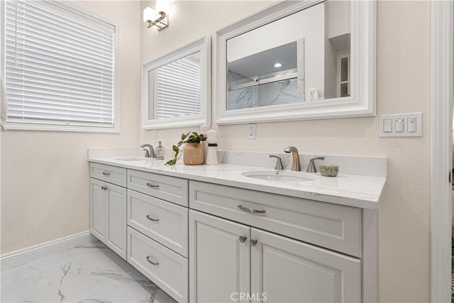2944 Foothill Blvd, Oroville, CA 95966 - bathroom featuring marble finish flooring, double vanity, and baseboards