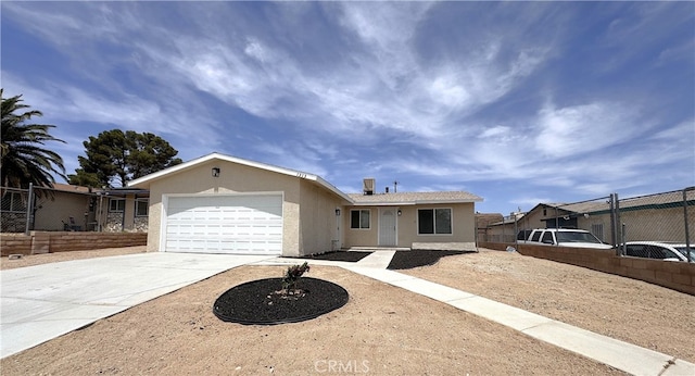 1313 Piute St, Barstow, CA 92311 - ranch-style home with stucco siding, fence, concrete driveway, and an attached garage