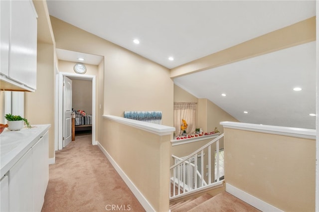 11149 Liverpool Ln, Riverside, CA 92503 - hallway featuring lofted ceiling, light colored carpet, baseboards, an upstairs landing, and recessed lighting