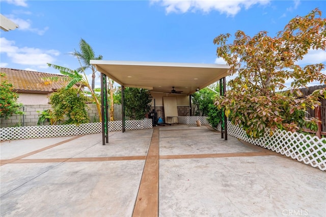 11149 Liverpool Ln, Riverside, CA 92503 - view of patio / terrace with ceiling fan, fence, a carport, and concrete driveway
