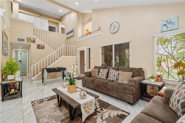11149 Liverpool Ln, Riverside, CA 92503 - living room with stairway, marble finish floors, high vaulted ceiling, baseboards, and recessed lighting