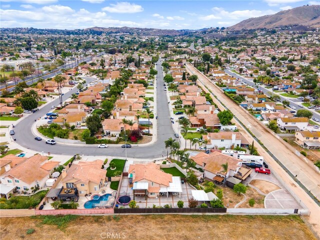 11149 Liverpool Ln, Riverside, CA 92503 - aerial overview of property's location with a mountain backdrop and nearby suburban area