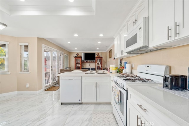 11149 Liverpool Ln, Riverside, CA 92503 - kitchen with white appliances, a sink, crown molding, a peninsula, and light countertops