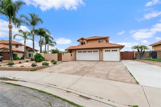 11149 Liverpool Ln, Riverside, CA 92503 - mediterranean / spanish-style home featuring stucco siding, a tiled roof, concrete driveway, fence, and an attached garage