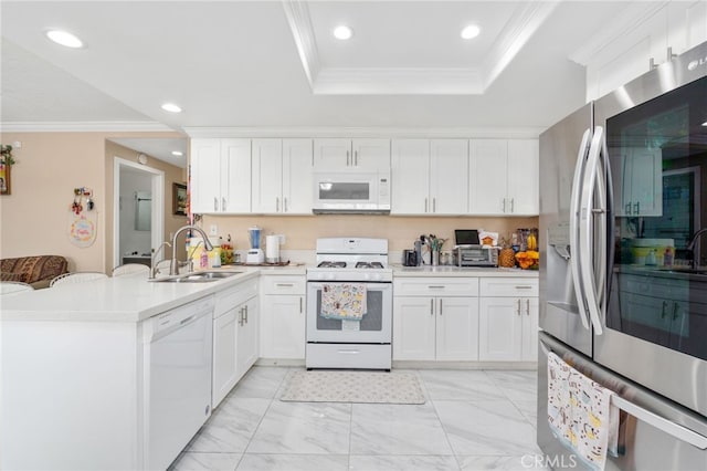 11149 Liverpool Ln, Riverside, CA 92503 - kitchen featuring white appliances, a sink, a peninsula, recessed lighting, and light countertops