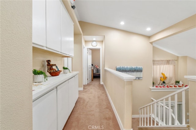 11149 Liverpool Ln, Riverside, CA 92503 - corridor featuring lofted ceiling, an upstairs landing, light carpet, baseboards, and recessed lighting