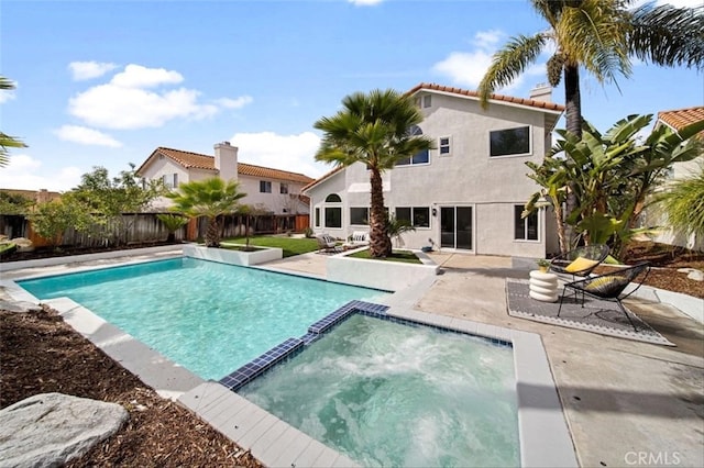 30901 Wellington Cir, Temecula, CA 92591 - view of swimming pool with a patio, a pool with connected hot tub, and a fenced backyard
