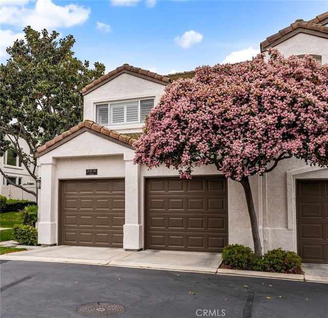 2130 Almeria St Unit 101, Corona, CA 92879 - view of front facade with a tile roof and stucco siding