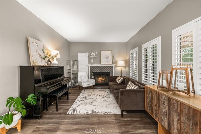 2130 Almeria St Unit 101, Corona, CA 92879 - living area featuring dark wood-style flooring and a tile fireplace