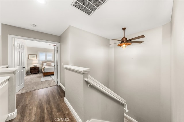 2130 Almeria St Unit 101, Corona, CA 92879 - corridor featuring an upstairs landing, dark wood finished floors, and baseboards