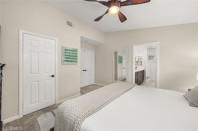 2130 Almeria St Unit 101, Corona, CA 92879 - bedroom featuring baseboards, ensuite bathroom, light carpet, and ceiling fan