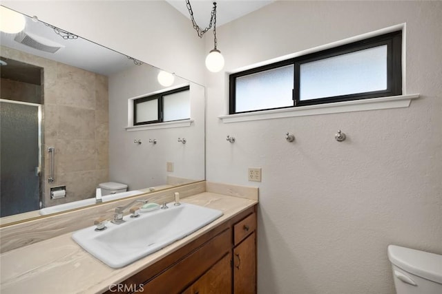 410 N Las Flores Dr, Nipomo, CA 93444 - bathroom featuring toilet, a shower stall, and vanity