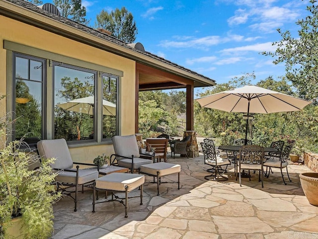 view of patio with outdoor dining area