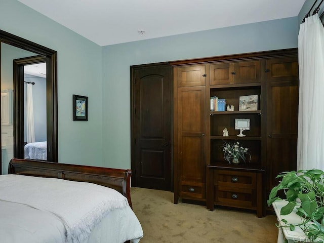 bedroom with light carpet