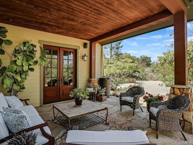 view of patio with french doors and outdoor lounge area
