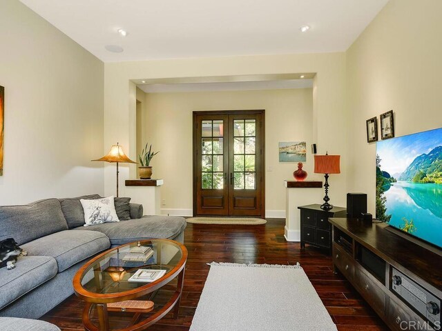 living room featuring wood finished floors, french doors, baseboards, and recessed lighting