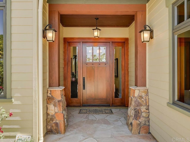 view of exterior entry featuring a porch