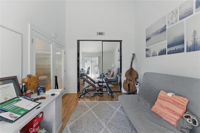 6621 Caro St Unit 111, Paramount, CA 90723 - office with wood finished floors, a towering ceiling, and baseboards