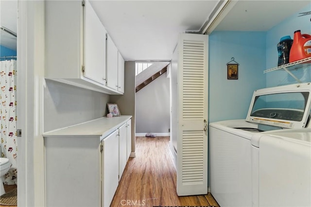 6621 Caro St Unit 111, Paramount, CA 90723 - laundry area featuring washer and dryer and light wood finished floors