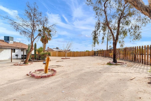 fenced backyard featuring cooling unit