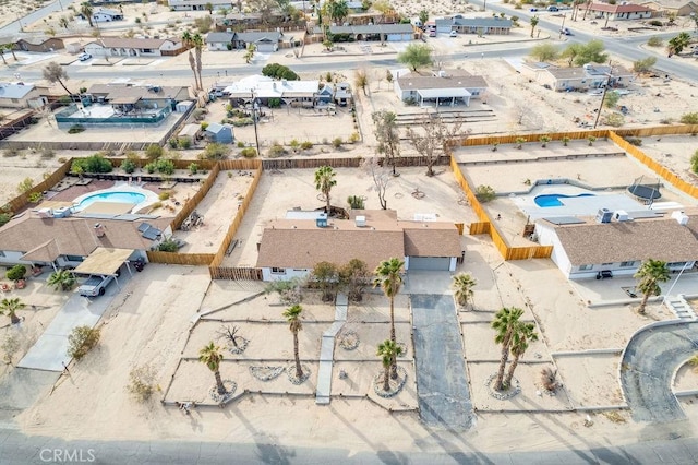 aerial view of residential area featuring a pool