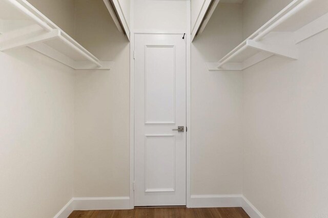 2404 Altisma Way Unit C, Carlsbad, CA 92009 - walk in closet with wood finished floors
