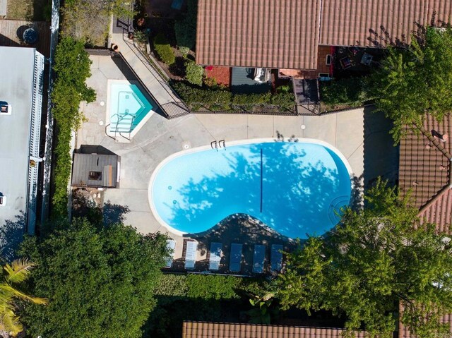 2404 Altisma Way Unit C, Carlsbad, CA 92009 - aerial view of property and surrounding area featuring a pool area