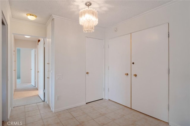 32735 Seagate Dr Unit 304-D, Rancho Palos Verdes, CA 90275 - unfurnished bedroom with a chandelier, a textured ceiling, crown molding, and a closet