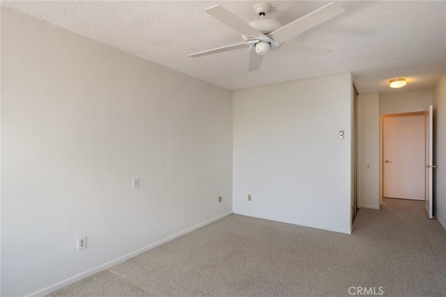 32735 Seagate Dr Unit 304-D, Rancho Palos Verdes, CA 90275 - spare room featuring light carpet, a ceiling fan, and a textured ceiling