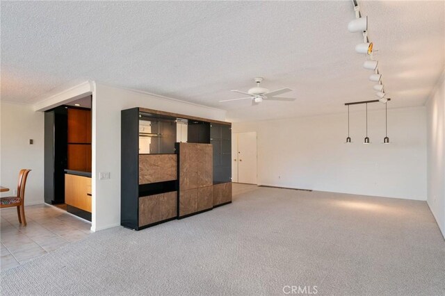 32735 Seagate Dr Unit 304-D, Rancho Palos Verdes, CA 90275 - spare room with rail lighting, a ceiling fan, light carpet, a textured ceiling, and light tile patterned floors