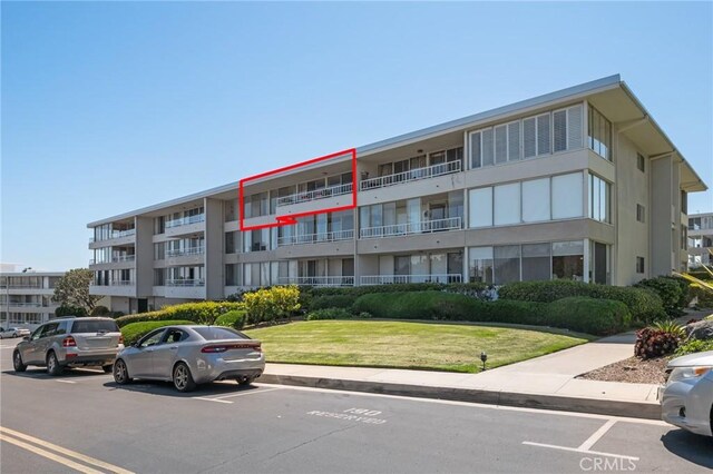 32735 Seagate Dr Unit 304-D, Rancho Palos Verdes, CA 90275 - view of apartment building / complex featuring uncovered parking