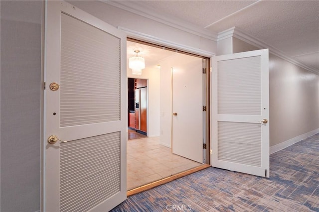 32735 Seagate Dr Unit 304-D, Rancho Palos Verdes, CA 90275 - corridor featuring ornamental molding, carpet, a textured ceiling, and baseboards