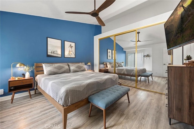 5814 Old Village Rd Unit 216, Yorba Linda, CA 92887 - bedroom with light wood-type flooring, vaulted ceiling, a closet, baseboards, and a ceiling fan