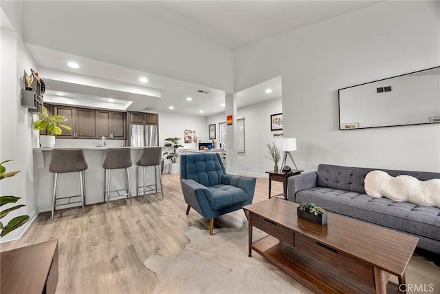 5814 Old Village Rd Unit 216, Yorba Linda, CA 92887 - living area featuring light wood-type flooring, recessed lighting, and baseboards