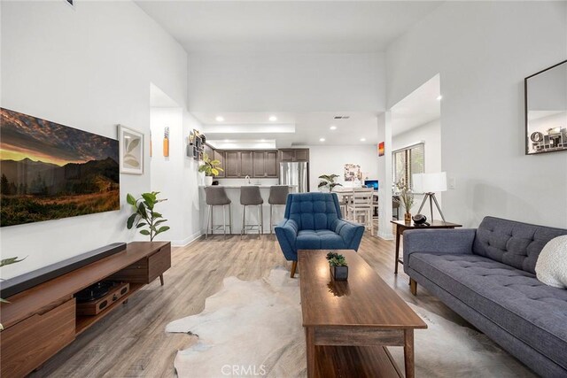 5814 Old Village Rd Unit 216, Yorba Linda, CA 92887 - living room featuring light wood-style floors, recessed lighting, and a high ceiling