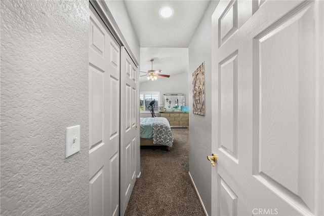 35189 Ravencrest Ct, Yucaipa, CA 92399 - corridor featuring a textured wall, carpet flooring, and baseboards