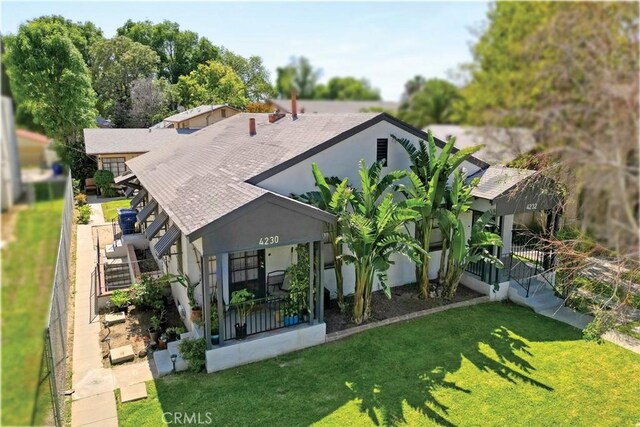 4228 10th St, Riverside, CA 92501 - back of property with a lawn and stucco siding