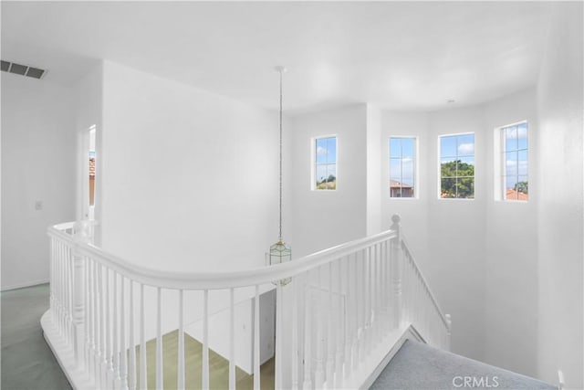 corridor featuring an upstairs landing