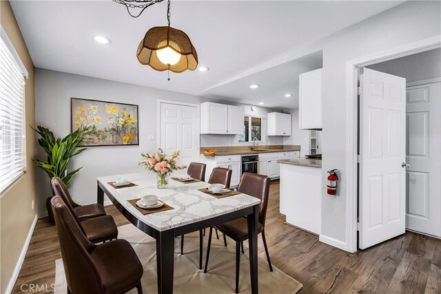 57330 Old Haggard Rd, Yucca Valley, CA 92284 - dining area featuring baseboards, dark wood-style floors, and recessed lighting