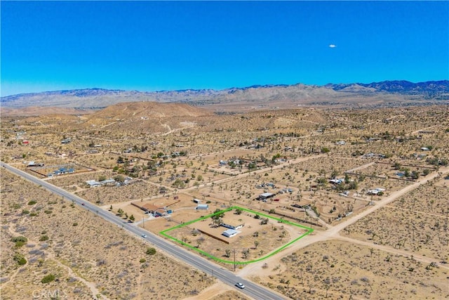 57330 Old Haggard Rd, Yucca Valley, CA 92284 - overview of rural landscape featuring a desert landscape, property boundaries highlighted, and a mountain backdrop