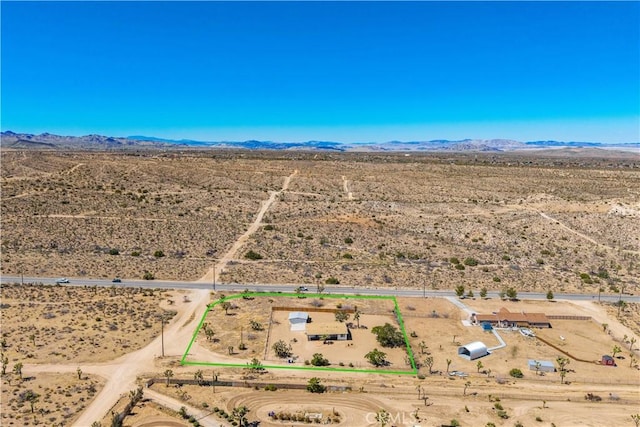 57330 Old Haggard Rd, Yucca Valley, CA 92284 - aerial view of sparsely populated area featuring a desert landscape, property boundaries highlighted, and mountains