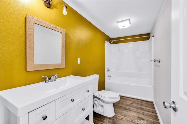 57330 Old Haggard Rd, Yucca Valley, CA 92284 - full bath featuring wood finished floors, toilet, vanity,  shower combination, and a textured wall
