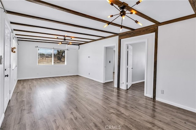 57330 Old Haggard Rd, Yucca Valley, CA 92284 - unfurnished living room with a chandelier, wood finished floors, baseboards, and beam ceiling