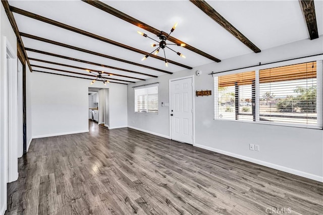 57330 Old Haggard Rd, Yucca Valley, CA 92284 - unfurnished living room featuring a chandelier, beam ceiling, baseboards, and dark wood-style flooring