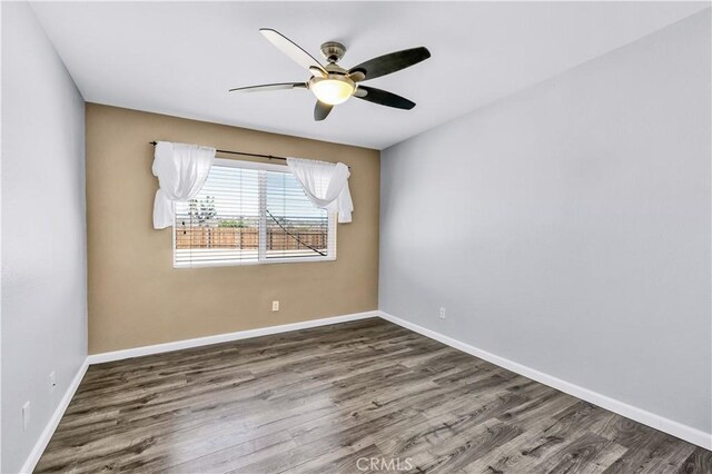 57330 Old Haggard Rd, Yucca Valley, CA 92284 - spare room featuring wood finished floors, baseboards, and a ceiling fan