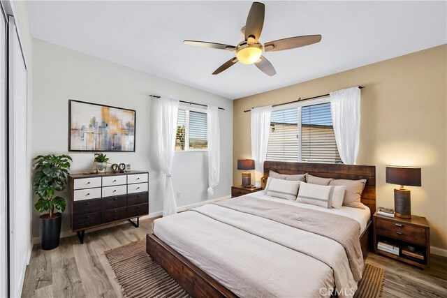 57330 Old Haggard Rd, Yucca Valley, CA 92284 - bedroom featuring light wood-style flooring, baseboards, and a ceiling fan